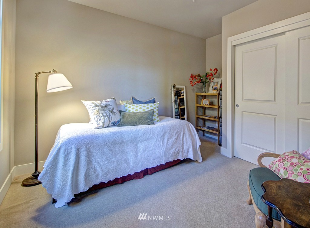 61 Pine Street, Unit 302 Edmonds, WA 98020 - Photo 17 of 25 a bedroom with a bed and closet