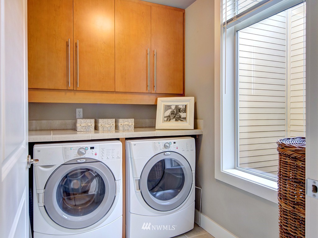 61 Pine Street, Unit 302 Edmonds, WA 98020 - Photo 22 of 25 a utility room with dryer and washer