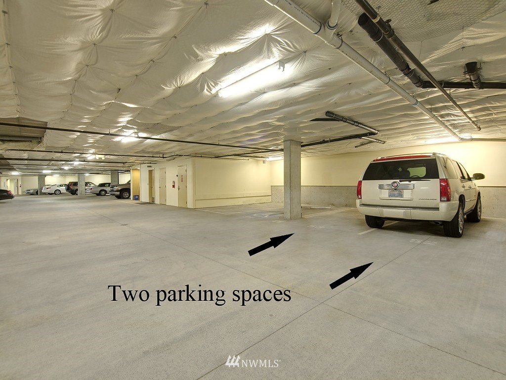 61 Pine Street, Unit 302 Edmonds, WA 98020 - Photo 23 of 25 a view of parking garage with cars