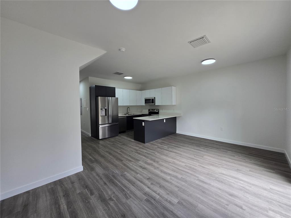 1601 Northwest 29 Road, Unit 3 Gainesville, FL 32605 - Photo 11 of 48 a view of kitchen and kitchen with a sink