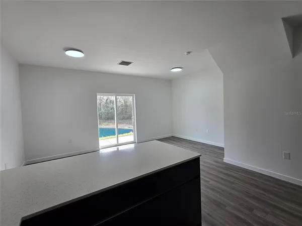 a view of walk in closet with wooden floor