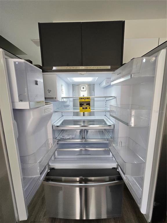 1601 Northwest 29 Road, Unit 3 Gainesville, FL 32605 - Photo 19 of 48 a view of walk in closet with wooden floor
