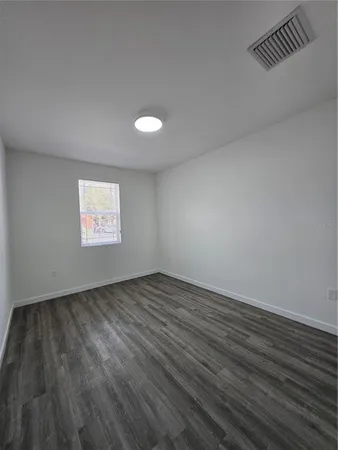 a bathroom with a sink a toilet a shower and a mirror