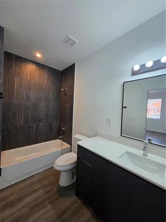 a bathroom with a bathtub and a sink
