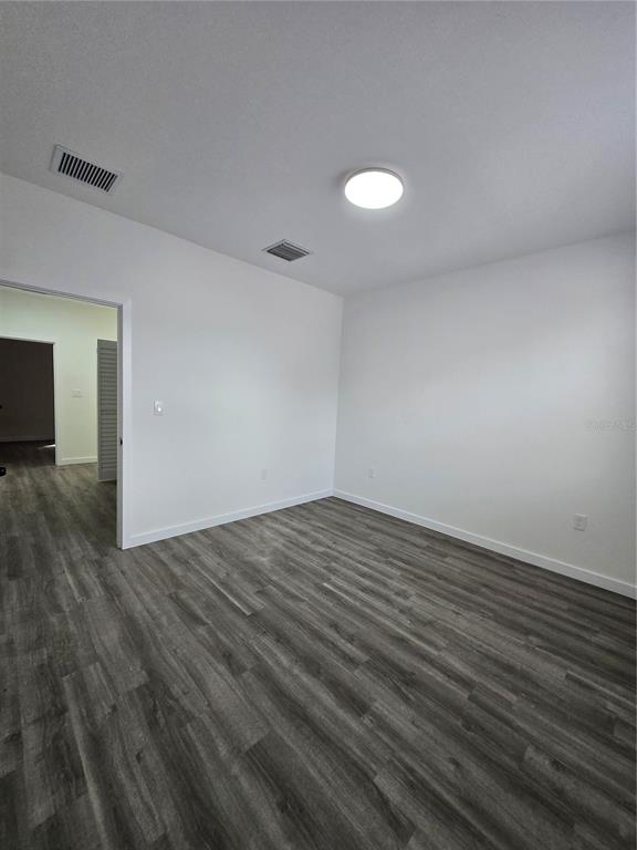 1601 Northwest 29 Road, Unit 3 Gainesville, FL 32605 - Photo 32 of 48 a view of empty room with wooden floor