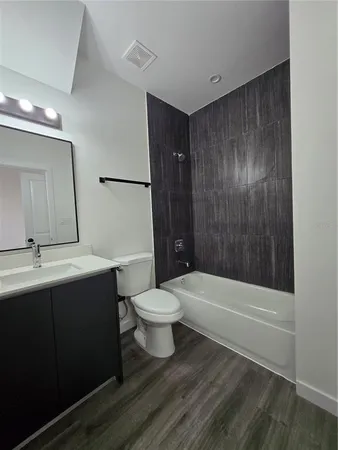 a bathroom with a toilet and shower