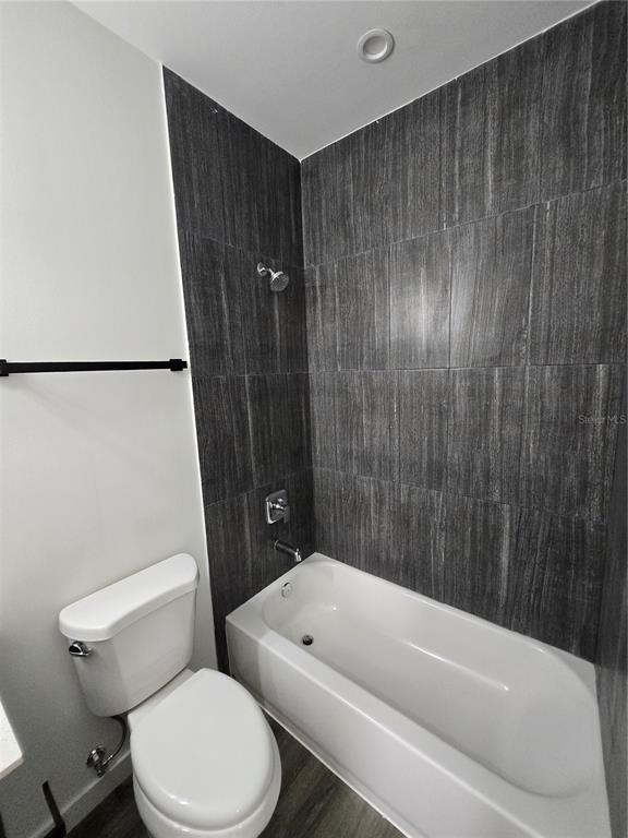 1601 Northwest 29 Road, Unit 3 Gainesville, FL 32605 - Photo 36 of 48 a bathroom with a toilet and shower