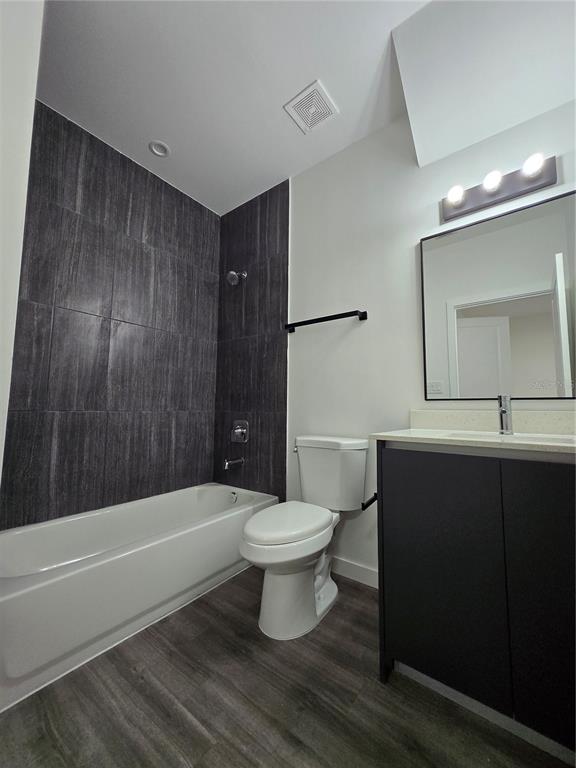 1601 Northwest 29 Road, Unit 3 Gainesville, FL 32605 - Photo 38 of 48 a bathroom with a sink a toilet and shower