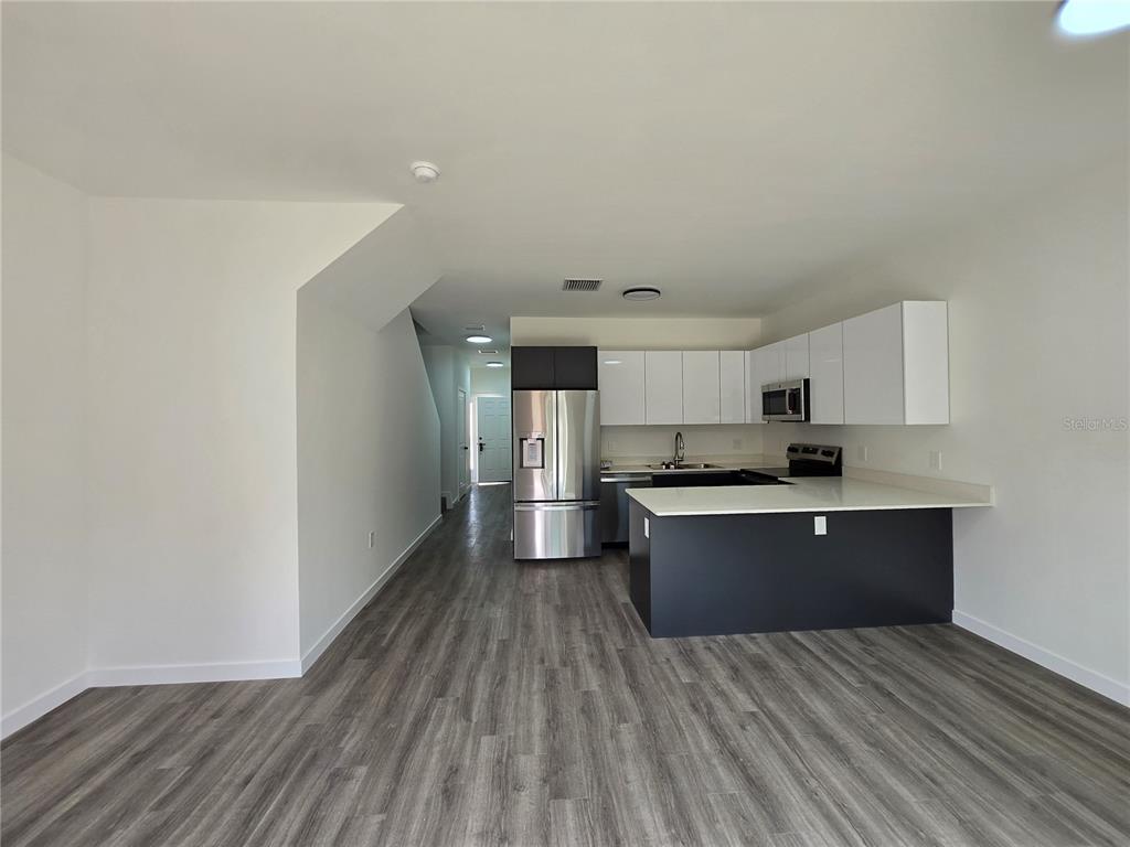 1601 Northwest 29 Road, Unit 3 Gainesville, FL 32605 - Photo 8 of 48 a view of kitchen with sink and microwave