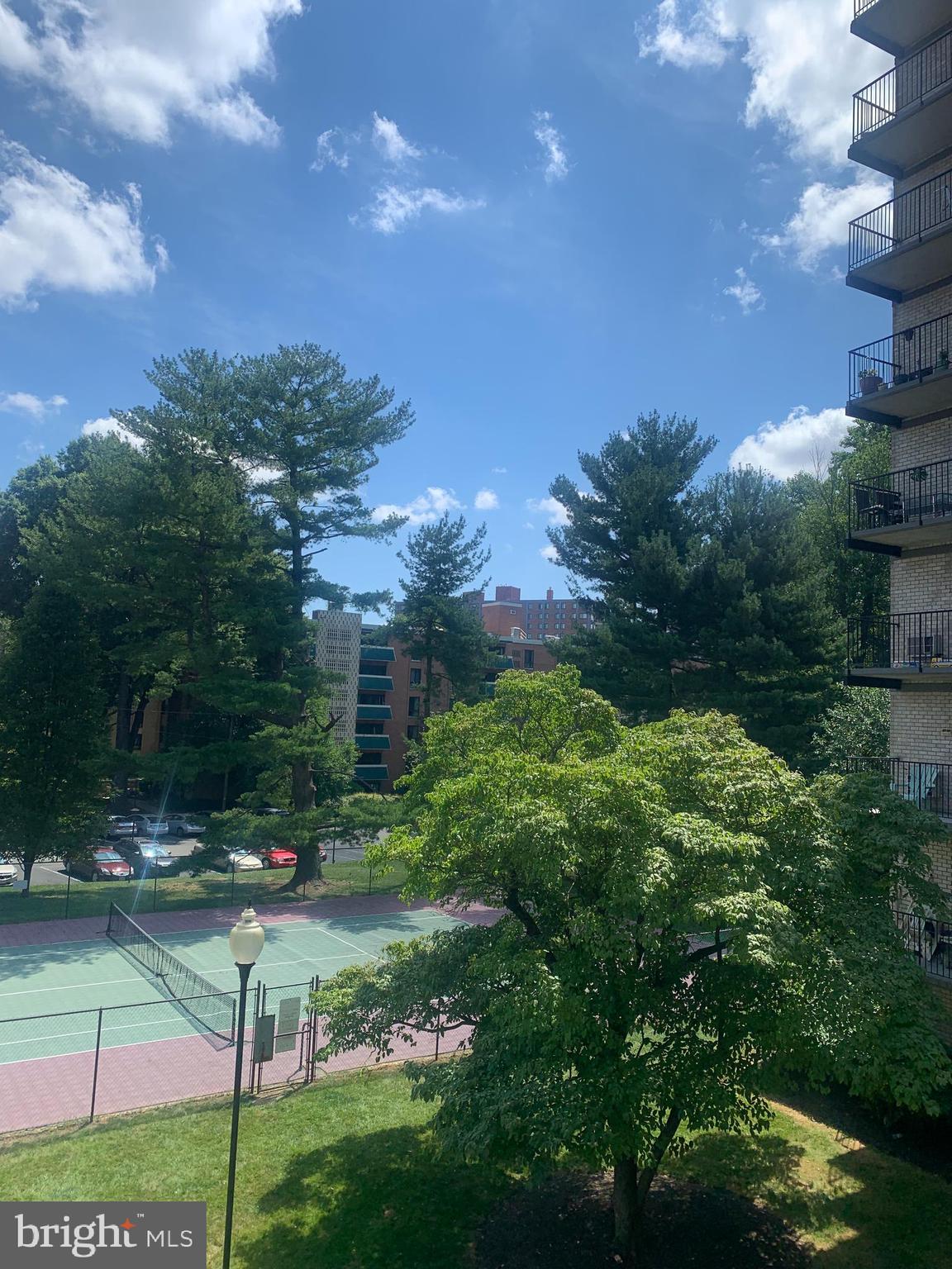 3245 Rio Drive, Unit 307 Falls Church, VA 22041 - Photo 17 of 39 a backyard of a house with lots of green space and fountain