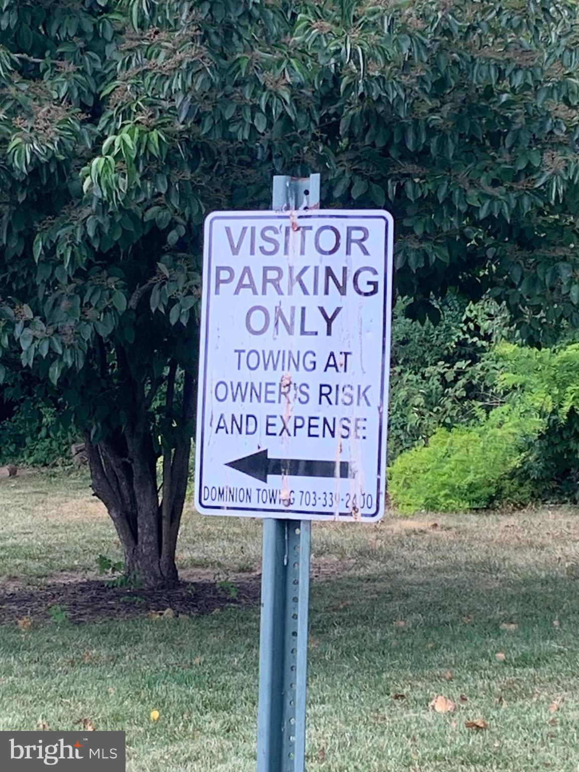 3245 Rio Drive, Unit 307 Falls Church, VA 22041 - Photo 22 of 39 a sign on the side of a road