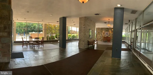 a view of a chair and table in the balcony