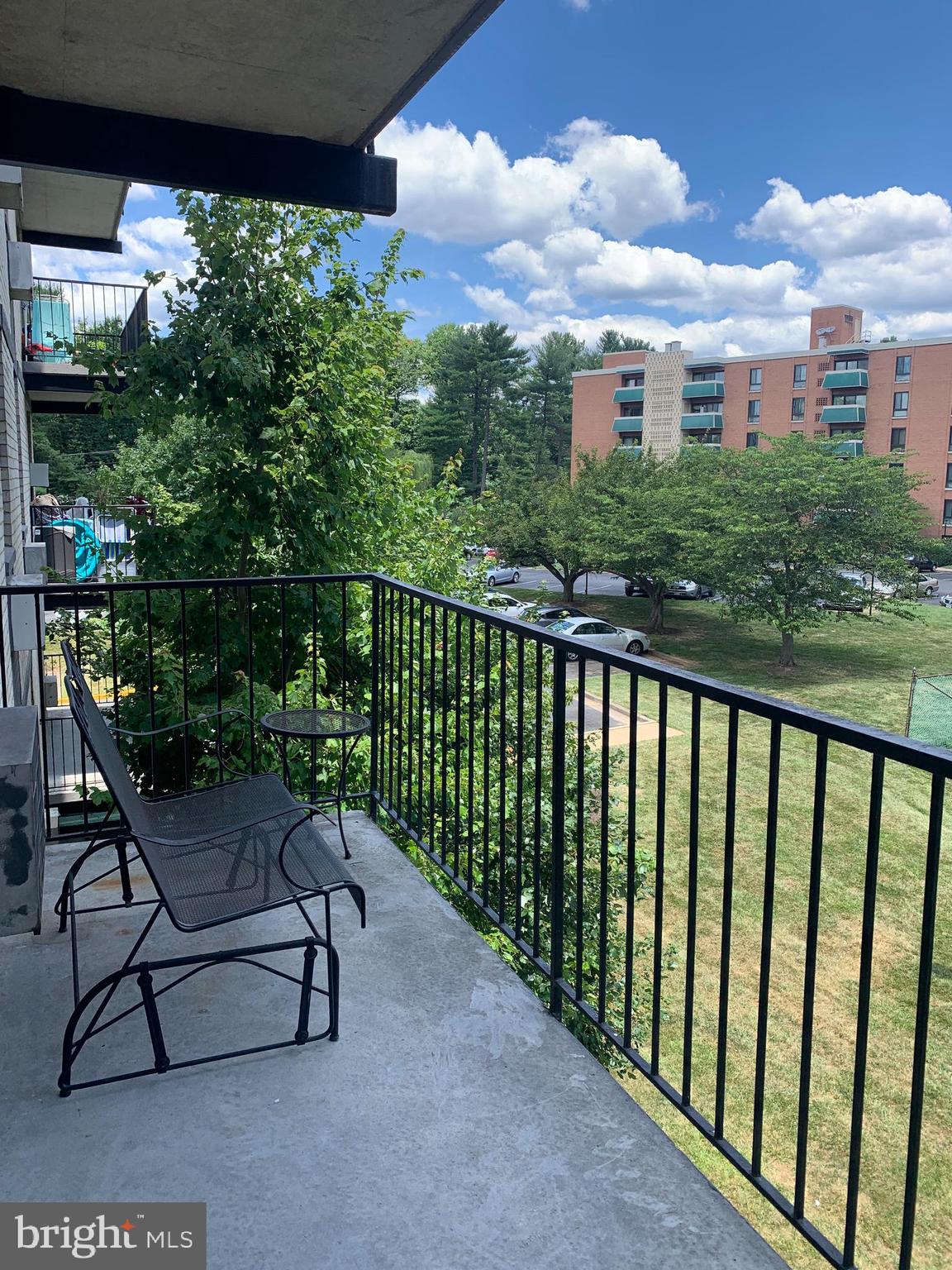 3245 Rio Drive, Unit 307 Falls Church, VA 22041 - Photo 28 of 39 a view of a chair and table in the balcony