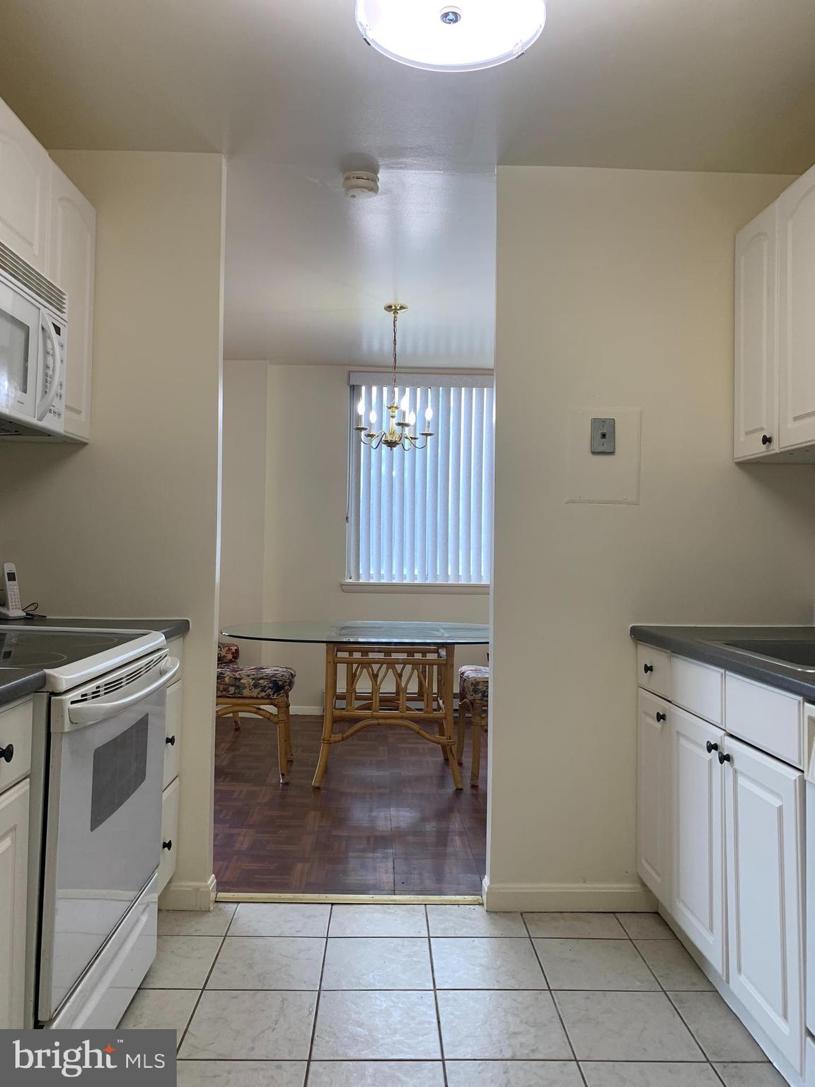3245 Rio Drive, Unit 307 Falls Church, VA 22041 - Photo 34 of 39 a view of a kitchen with cabinets