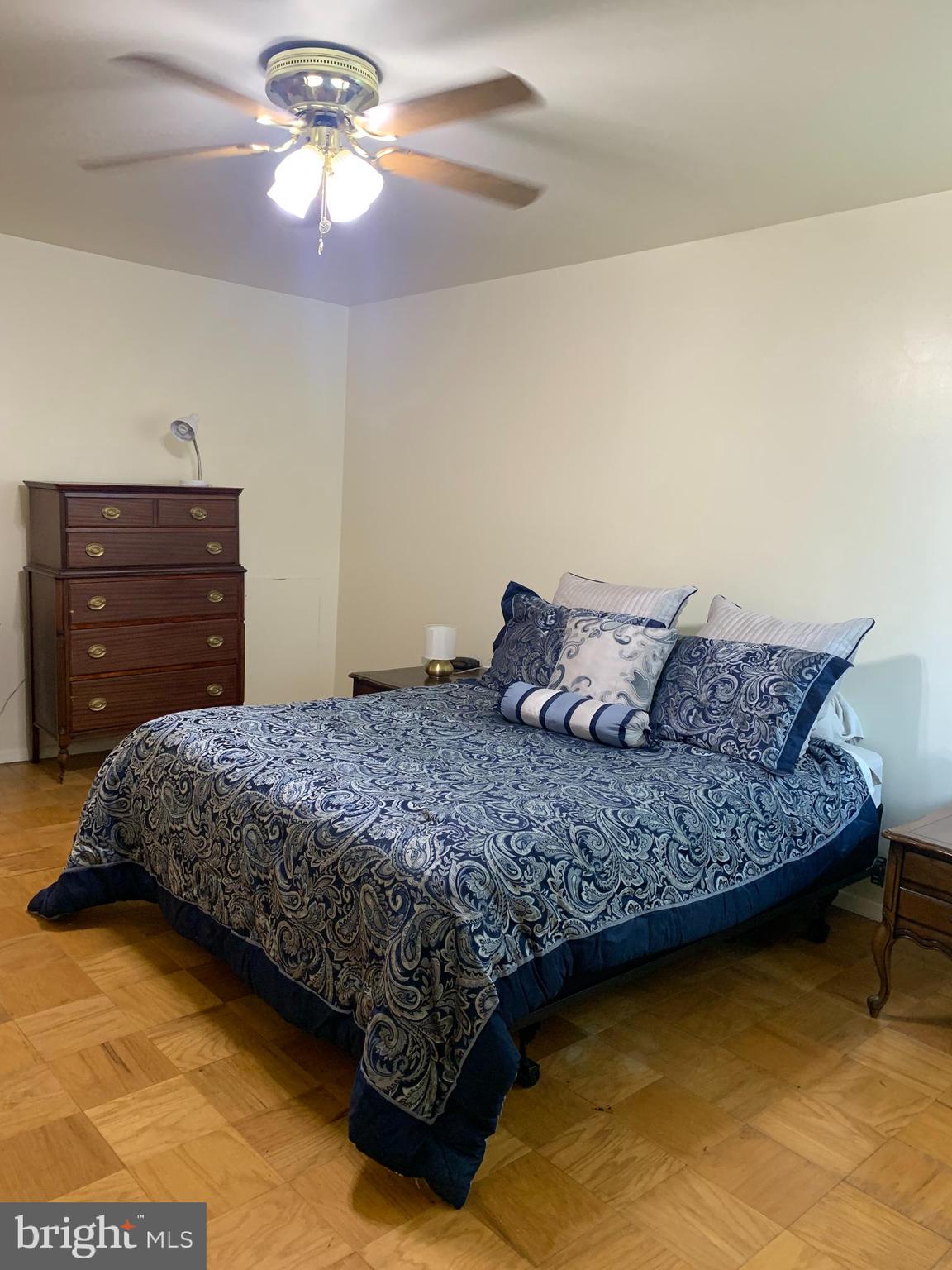 3245 Rio Drive, Unit 307 Falls Church, VA 22041 - Photo 38 of 39 a bedroom with a bed and a dresser