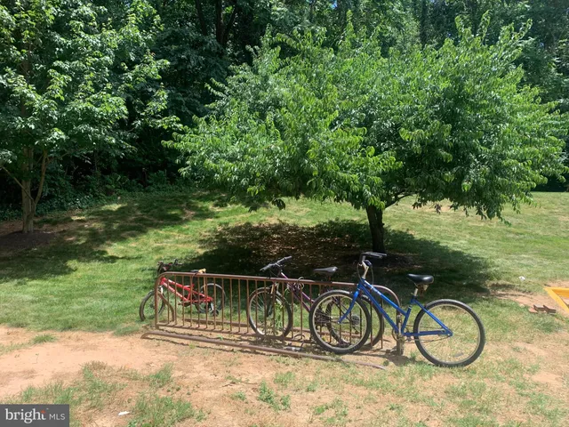 a couple of bicycles parked next to a yard