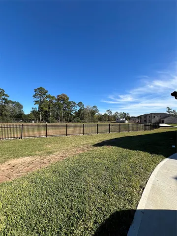 a view of a lake with a yard
