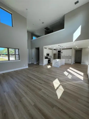 a living room with furniture window and wooden floor