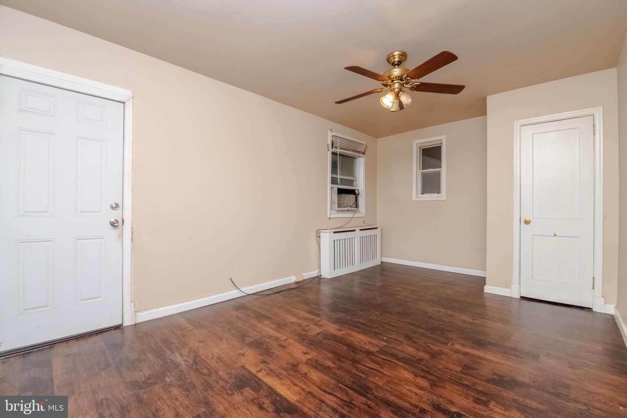 3500 4th Street Baltimore, MD 21225 - Photo 23 of 43 Spacious bedroom with warm wood flooring.