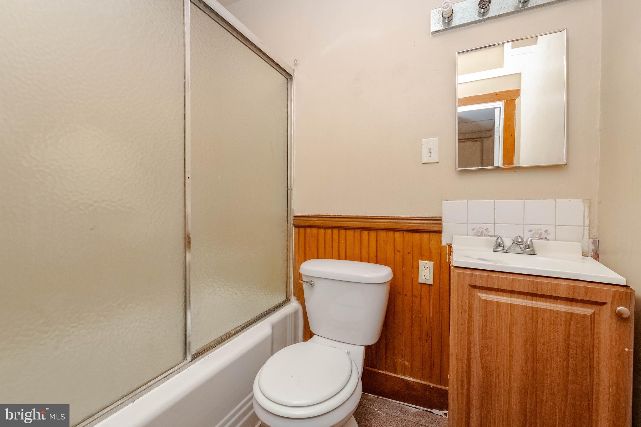3500 4th Street Baltimore, MD 21225 - Photo 31 of 43 Cozy bathroom with classic wood accents.