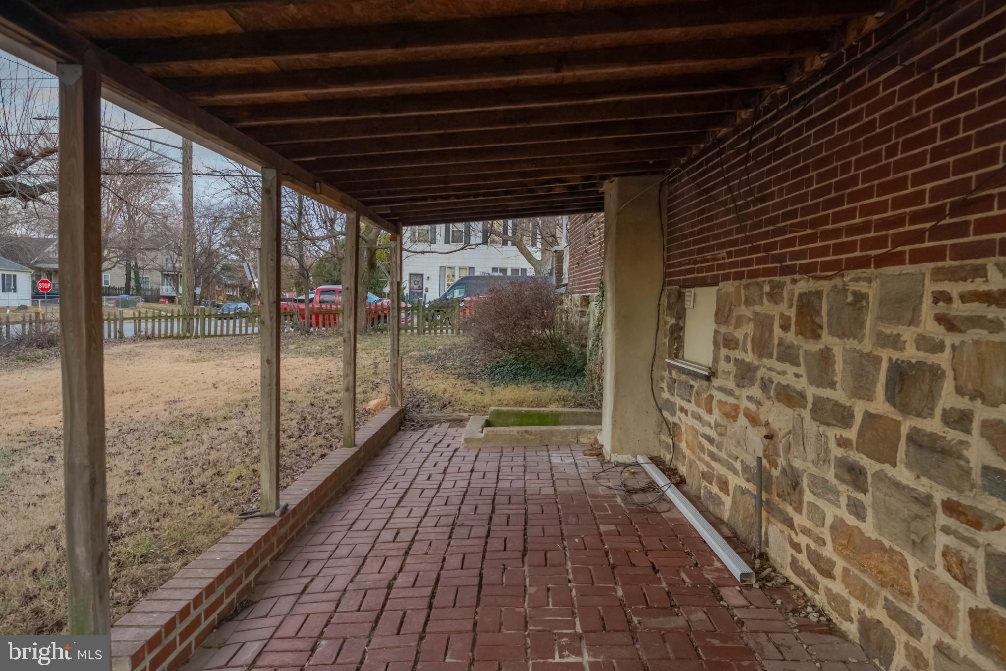 3500 4th Street Baltimore, MD 21225 - Photo 36 of 43 Covered patio at side entrance with rustic appeal.