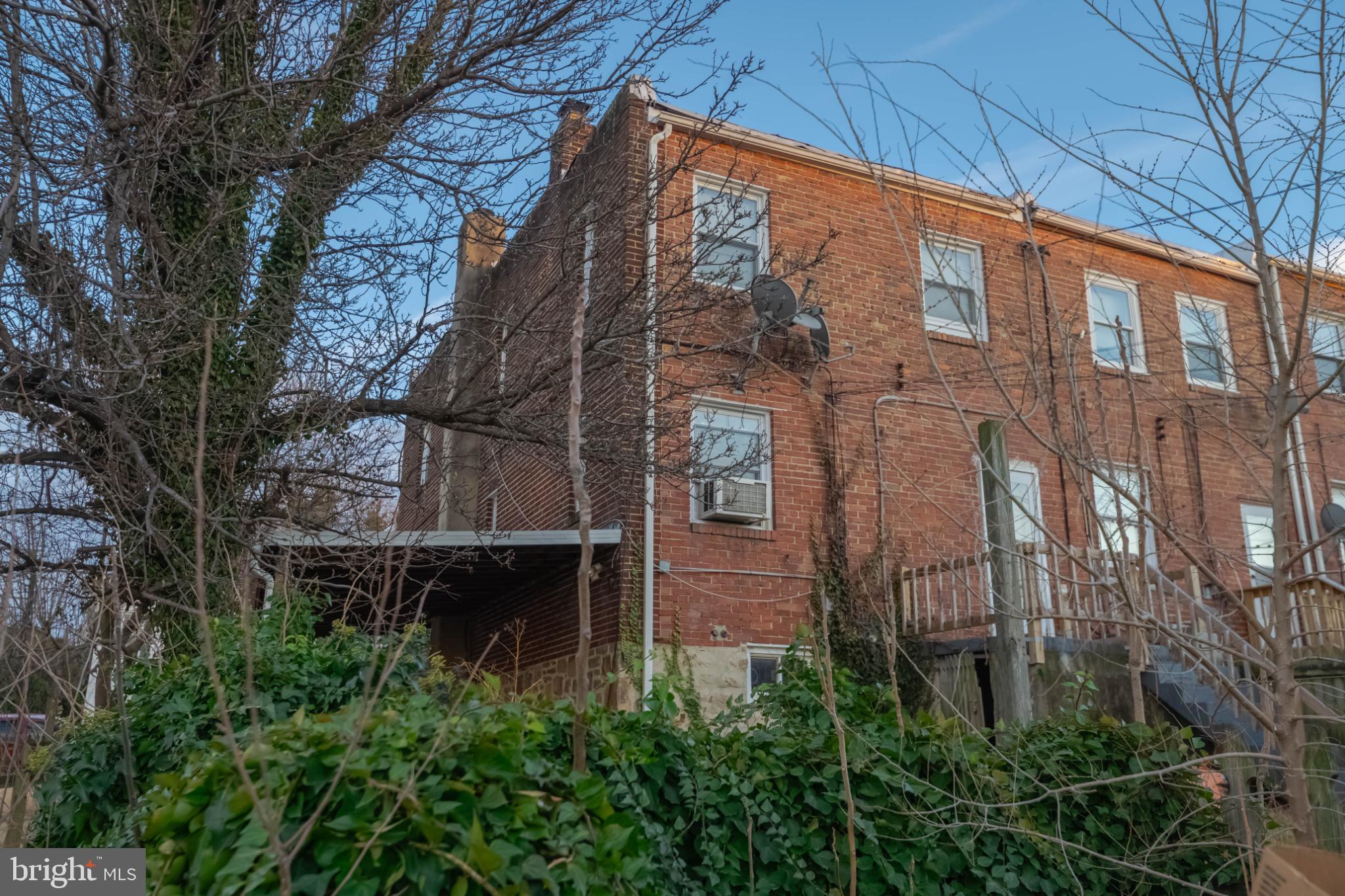 3500 4th Street Baltimore, MD 21225 - Photo 41 of 43 Charming brick home with lush greenery.