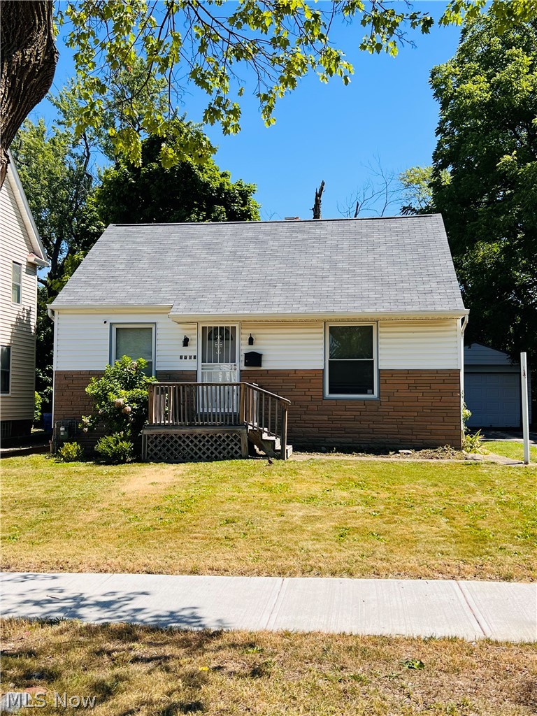 1763 Victoria Road Cleveland, OH 44112 - Photo 1 of 15 Ranch-style home featuring a porch and a front yard