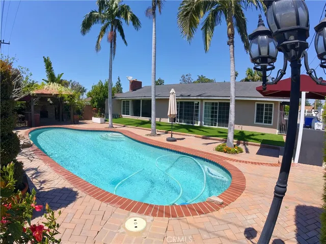 a view of a swimming pool with a patio