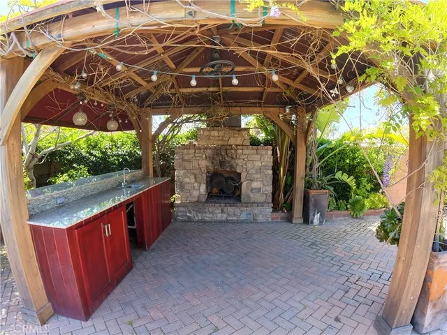 a view of a porch with furniture and a backyard