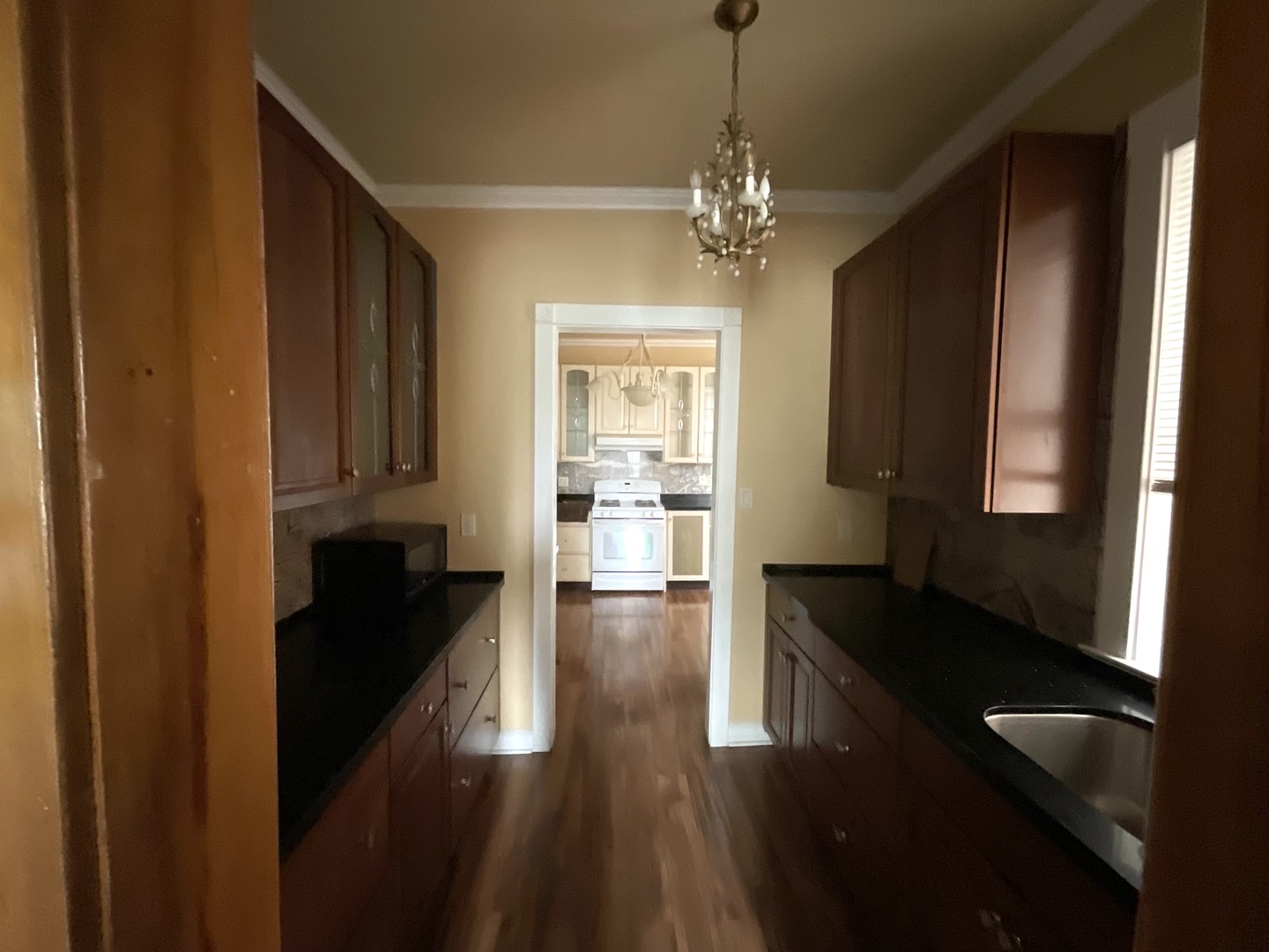5488 South Everett Avenue, Unit 2 Chicago, IL 60615 - Photo 11 of 29 a kitchen with granite countertop stove and refrigerator