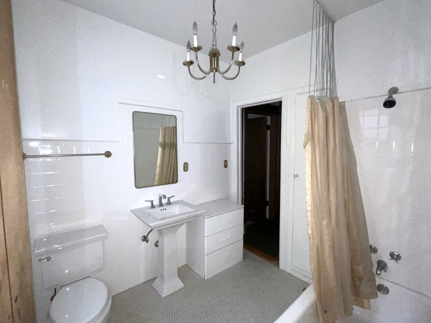5488 South Everett Avenue, Unit 2 Chicago, IL 60615 - Photo 19 of 29 a bathroom with a toilet a sink and a mirror