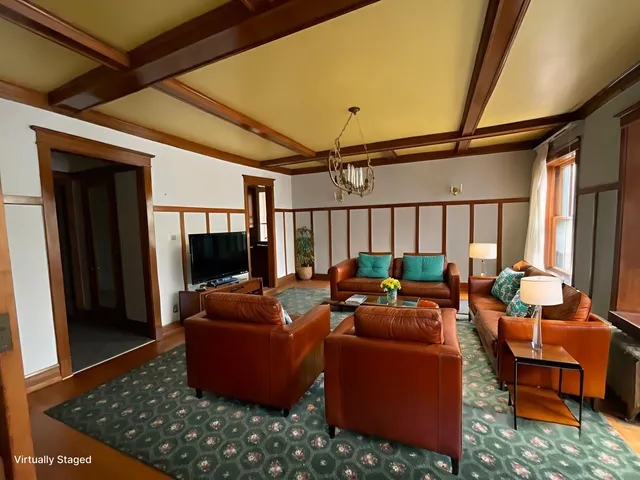a view of livingroom with hardwood floor and a ceiling fan