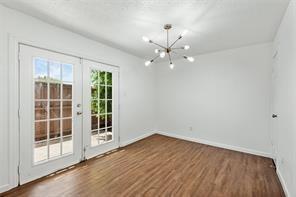 9524 Military Parkway, Unit 5002 Dallas, TX 75227 - Photo 7 of 11 an empty room with wooden floor and windows