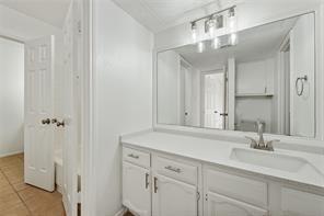 9524 Military Parkway, Unit 5002 Dallas, TX 75227 - Photo 8 of 11 a bathroom with a sink and a mirror