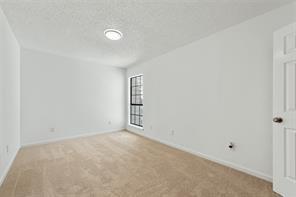 9524 Military Parkway, Unit 5002 Dallas, TX 75227 - Photo 9 of 11 an empty room with windows