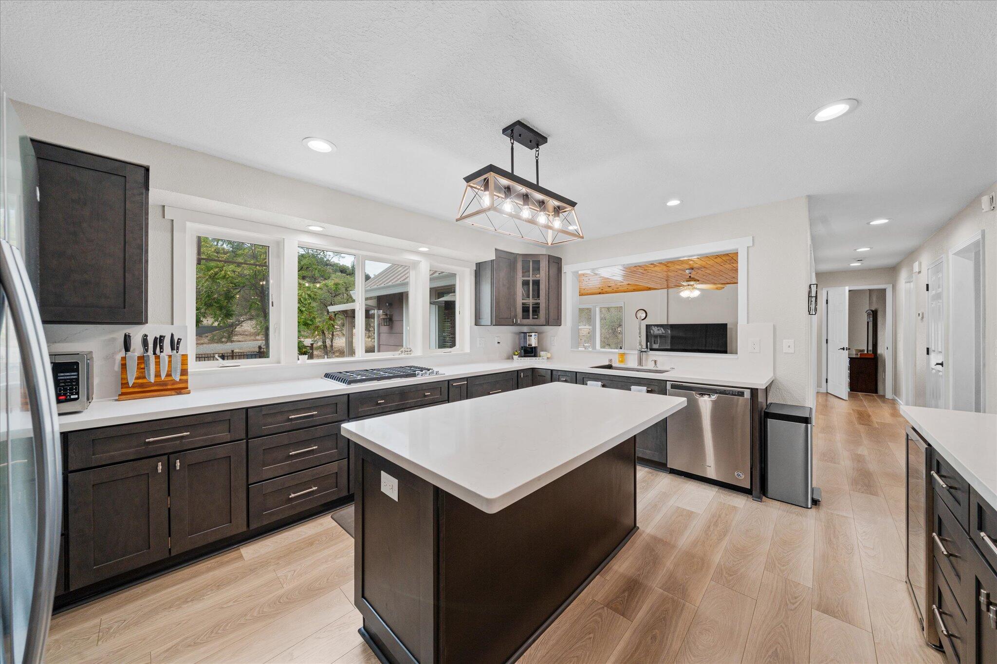 10190 Oak Run Road Oak Run, CA 96069 - Photo 13 of 78 a large kitchen with kitchen island a sink stainless steel appliances and cabinets