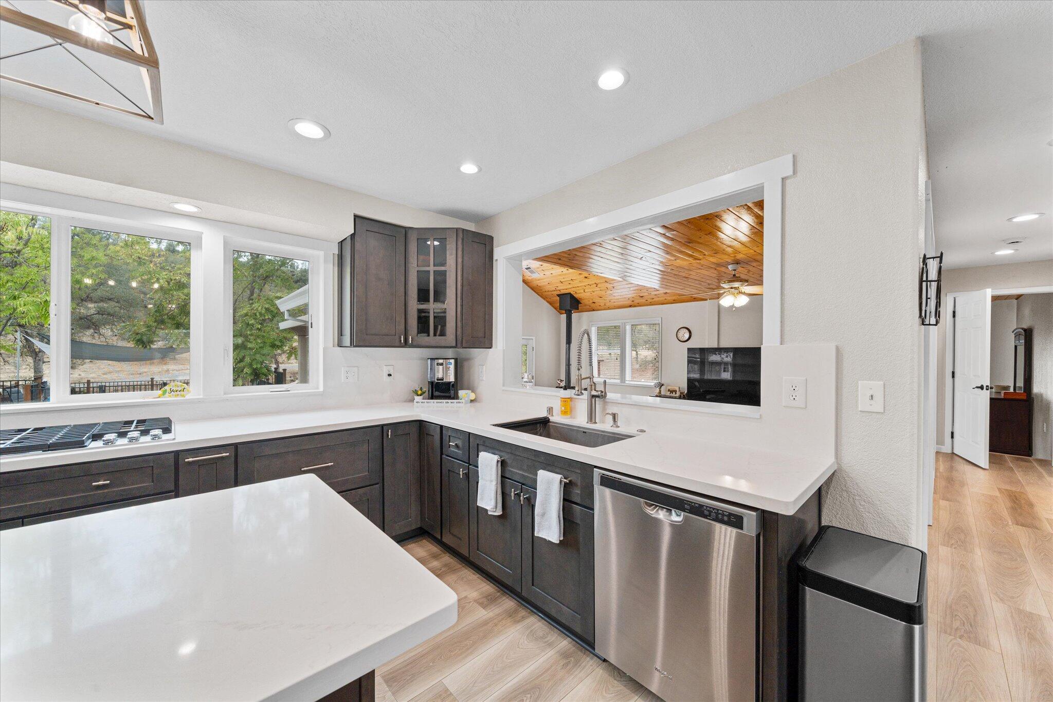 10190 Oak Run Road Oak Run, CA 96069 - Photo 14 of 78 a kitchen with stainless steel appliances granite countertop a sink a stove and a refrigerator