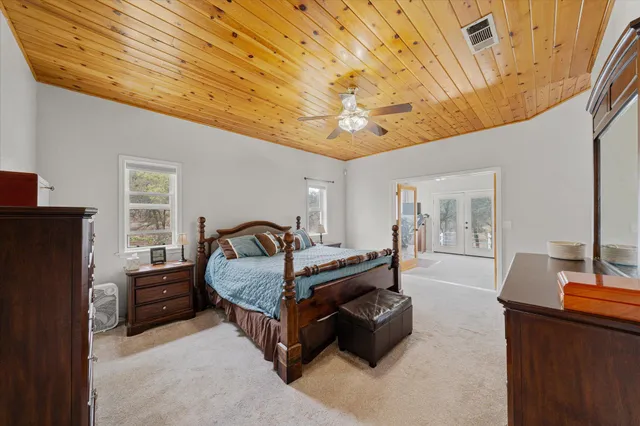a bedroom with furniture and a window