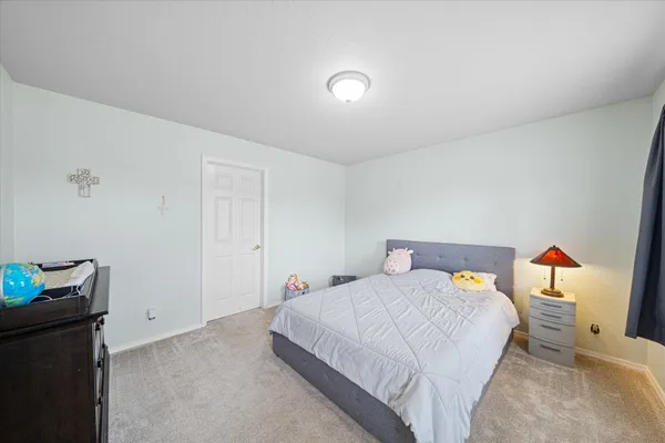 a view of a swimming pool with a yard