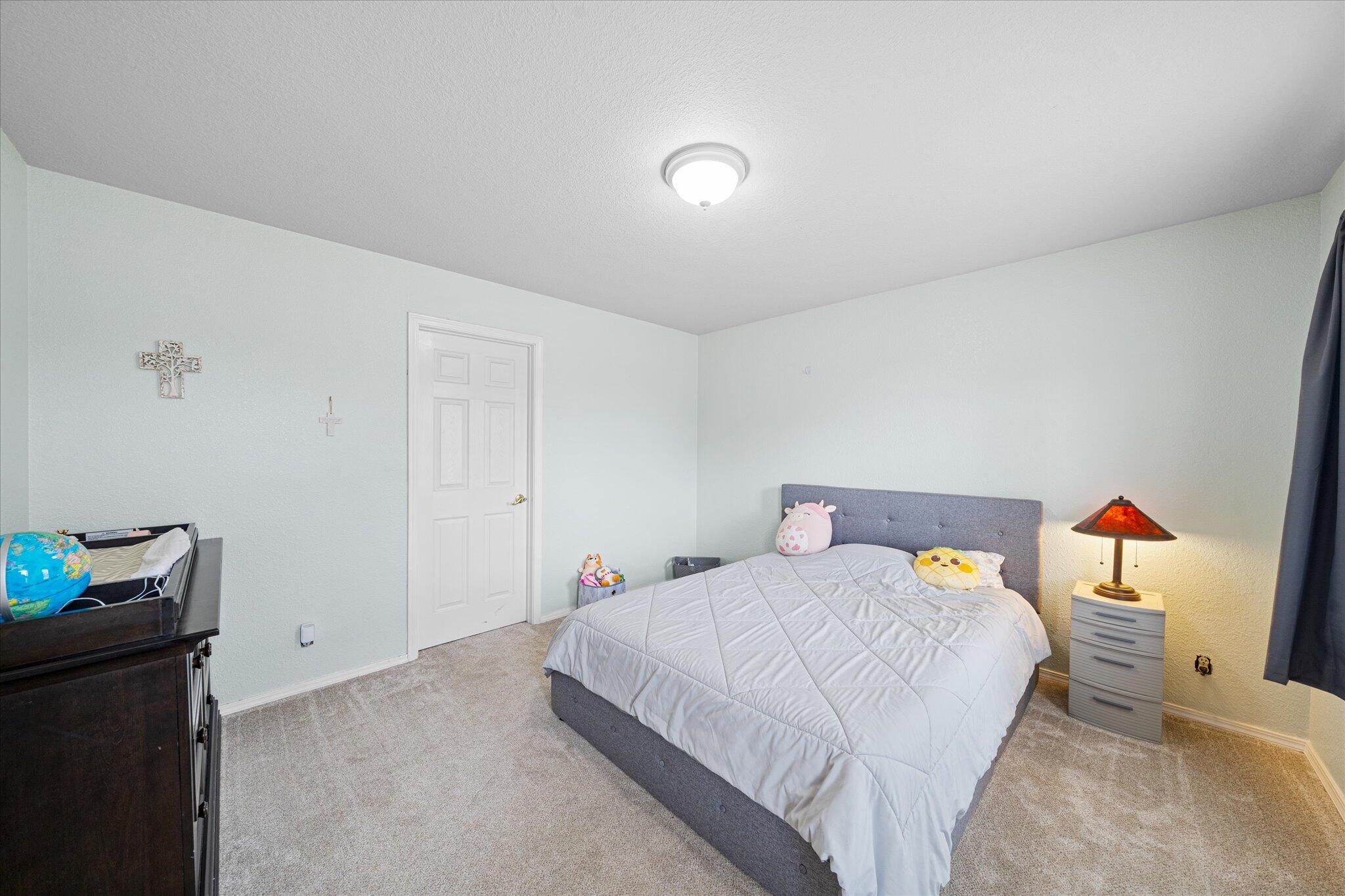 10190 Oak Run Road Oak Run, CA 96069 - Photo 30 of 78 a bedroom with a bed and wooden floor