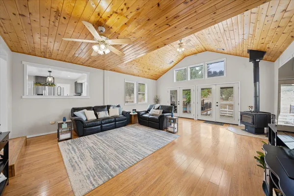 a large kitchen with kitchen island a sink stainless steel appliances and cabinets