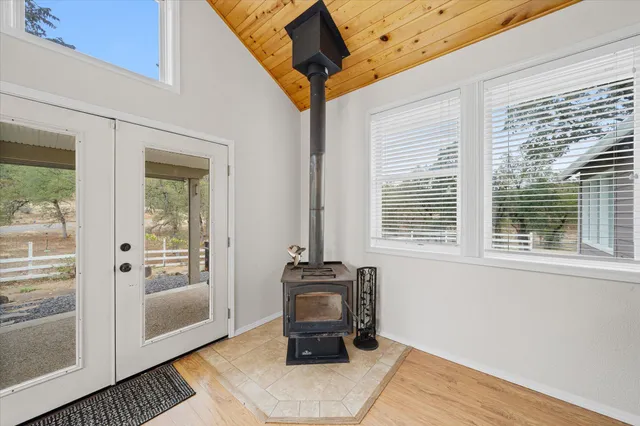 a kitchen with stainless steel appliances granite countertop a sink a stove and a refrigerator