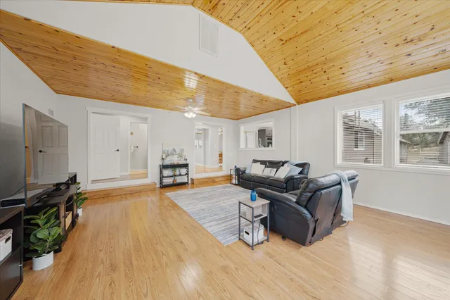a view of an entryway with wooden floor