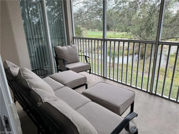 a balcony view with couple of chairs
