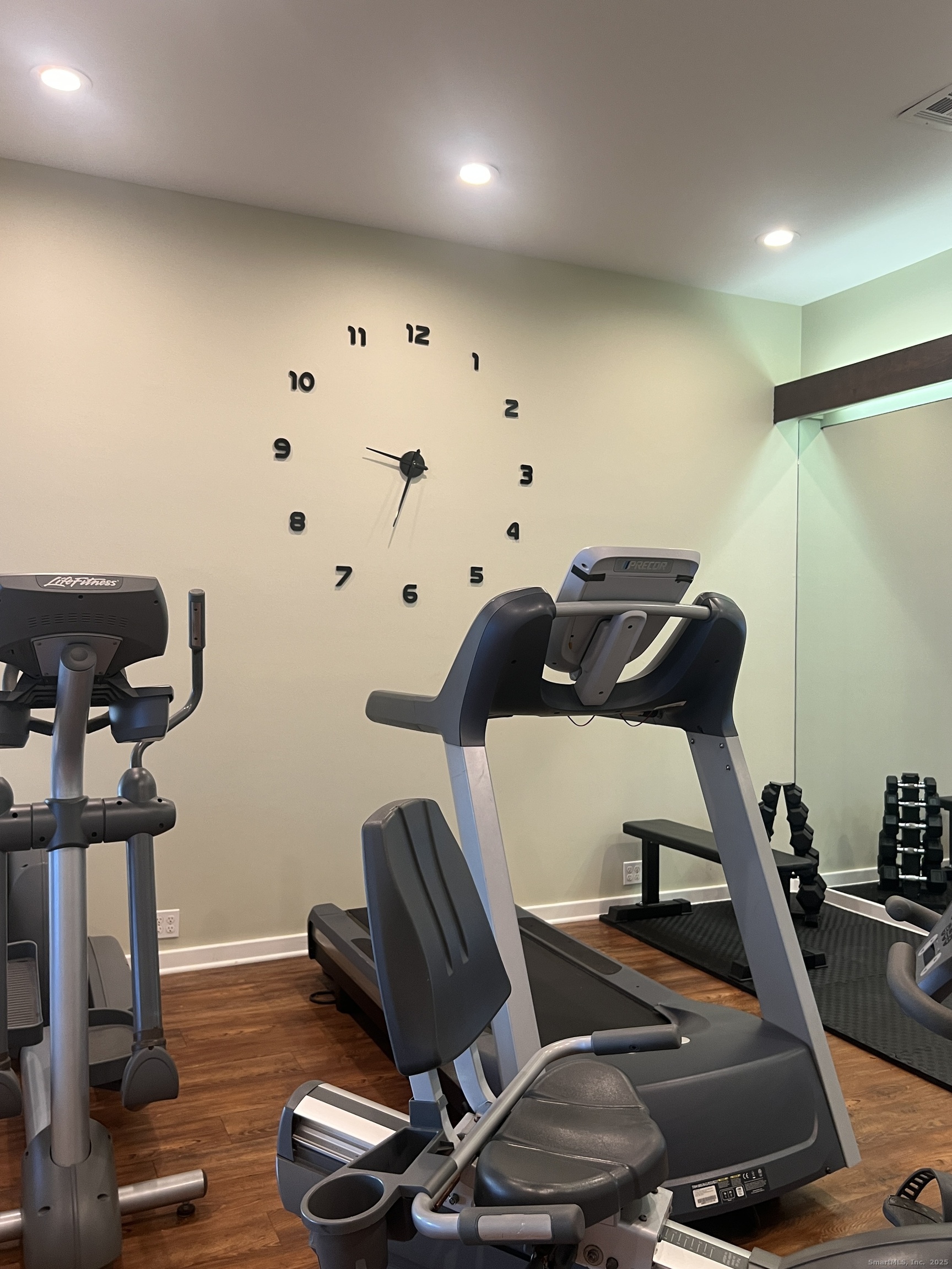 523 Old Pond Lane, Unit 523 Norwich, CT 06360 - Photo 19 of 25 a room with furniture and wooden floor