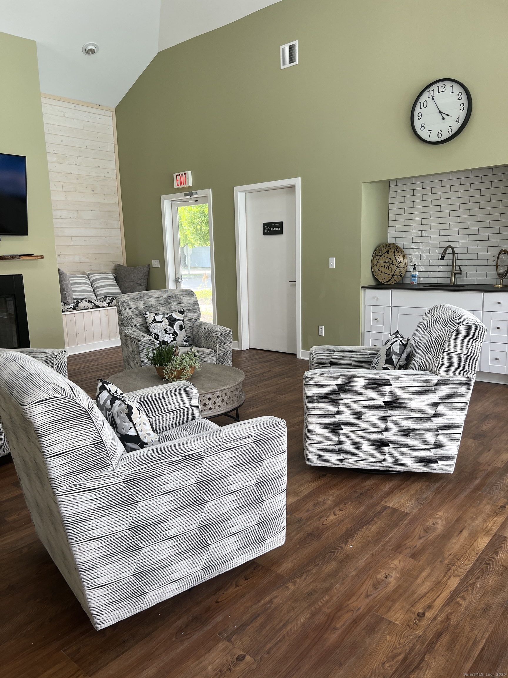 523 Old Pond Lane, Unit 523 Norwich, CT 06360 - Photo 23 of 25 a living room with furniture and a large mirror