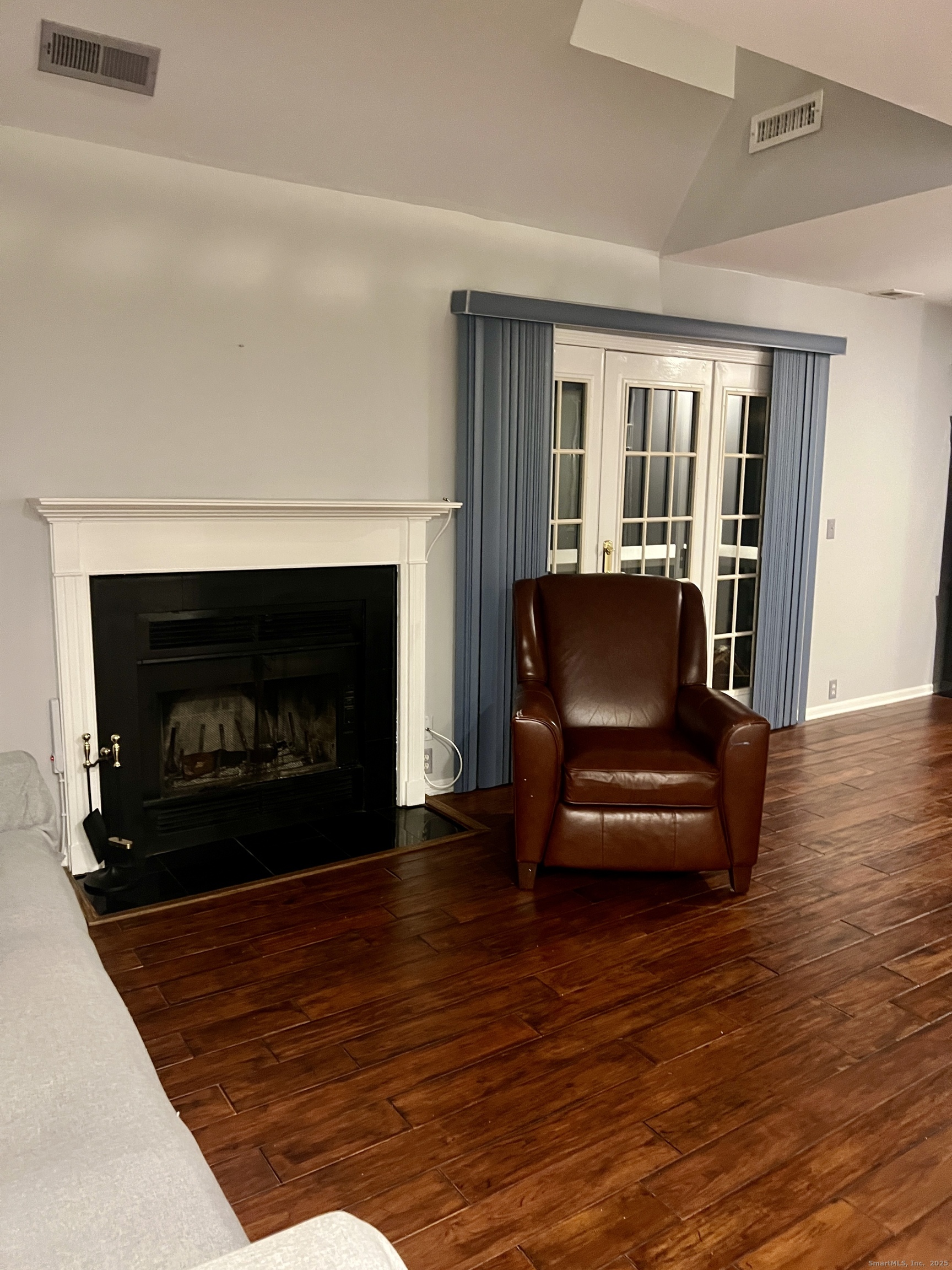 523 Old Pond Lane, Unit 523 Norwich, CT 06360 - Photo 4 of 25 a living room with furniture and a fireplace