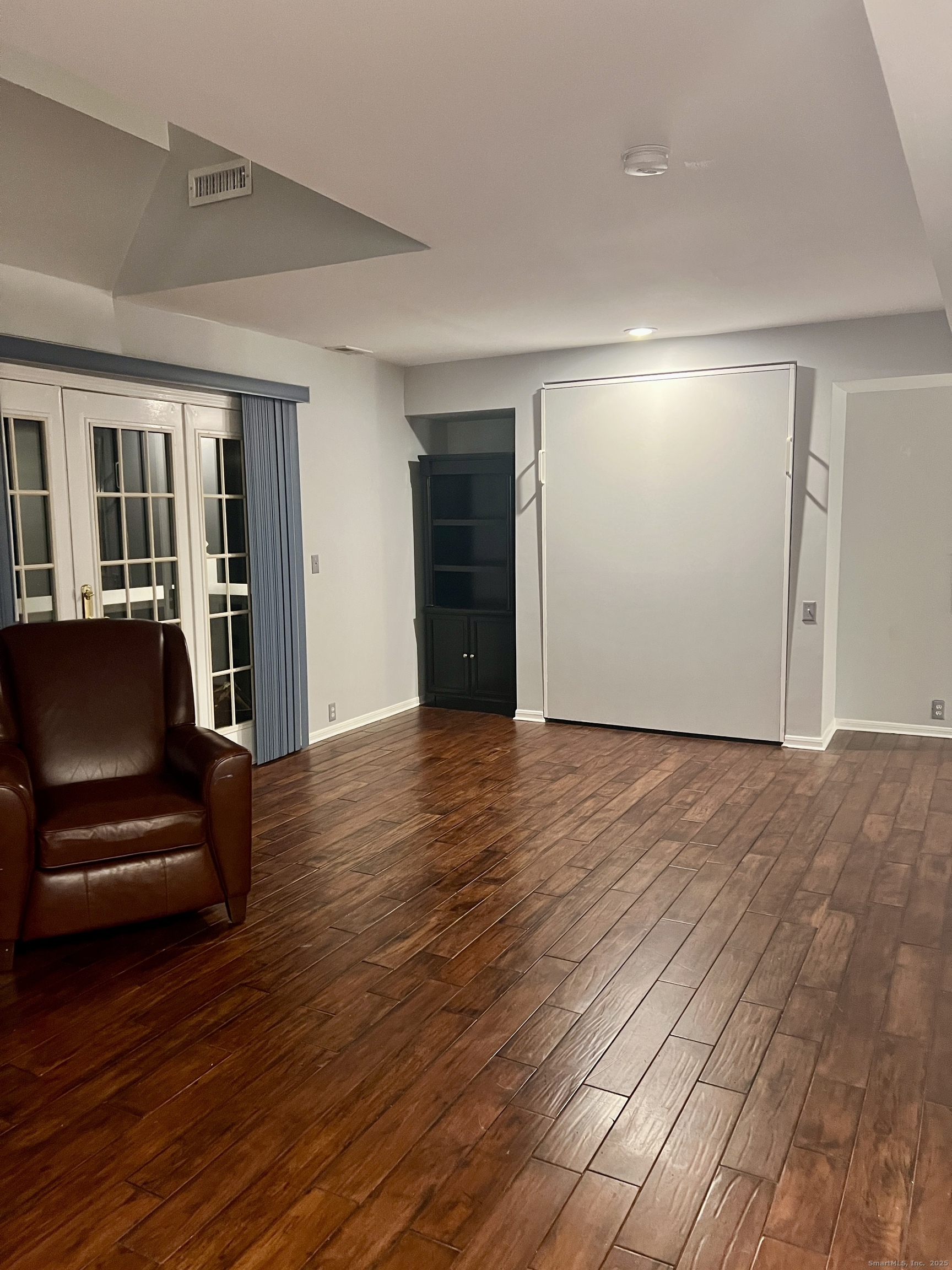 523 Old Pond Lane, Unit 523 Norwich, CT 06360 - Photo 5 of 25 a view of a livingroom with furniture and wooden floor