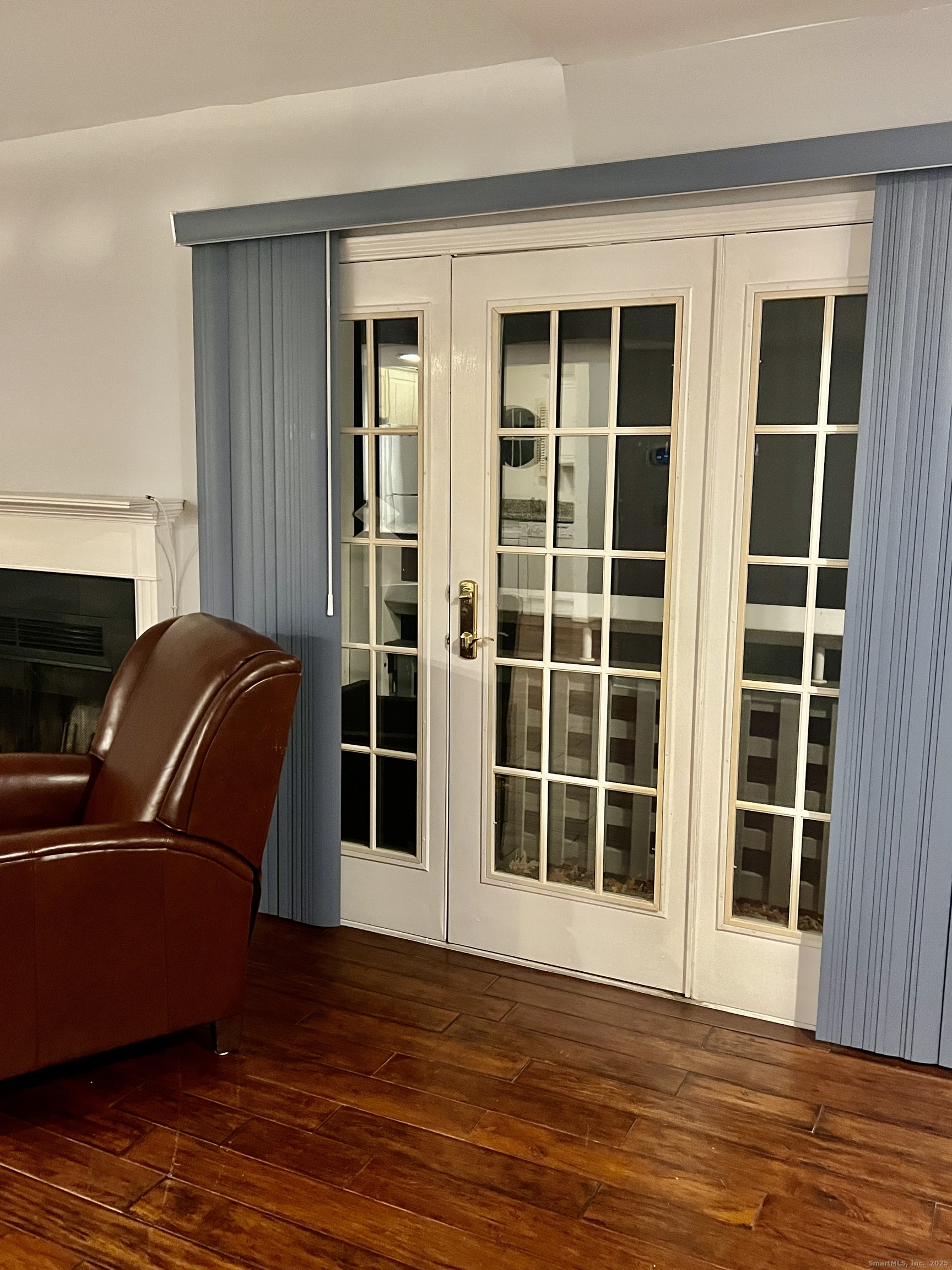 523 Old Pond Lane, Unit 523 Norwich, CT 06360 - Photo 6 of 25 a view of front door with wooden floor and windows