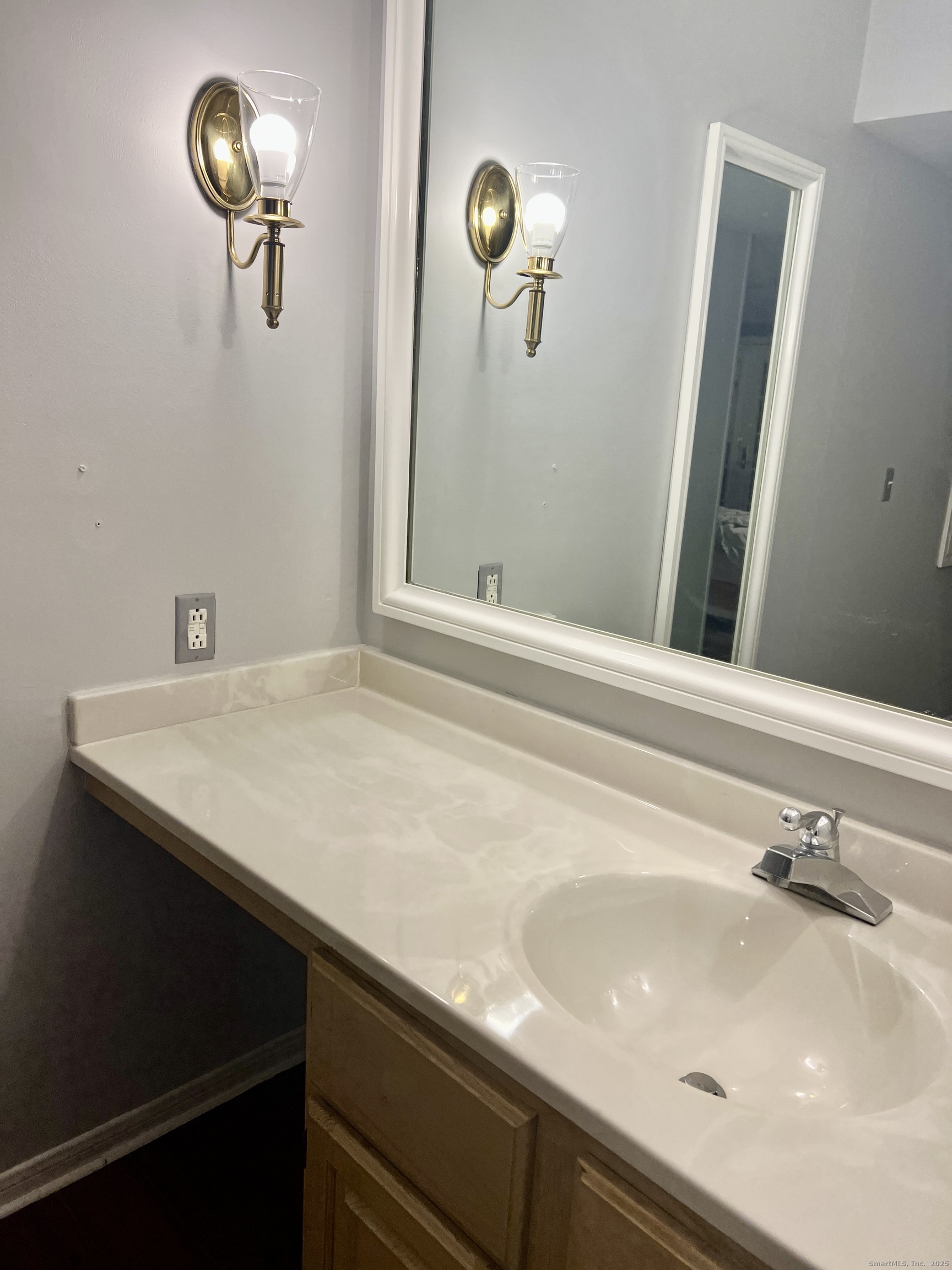 523 Old Pond Lane, Unit 523 Norwich, CT 06360 - Photo 10 of 25 a bathroom with a sink and a mirror